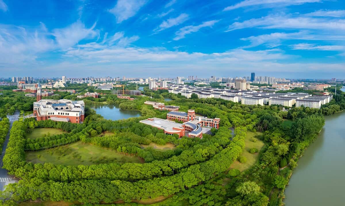 Aerial panoramic view of Songjiang University Town in Shanghai, study in China enviroment example, modern campus buildings and greenery