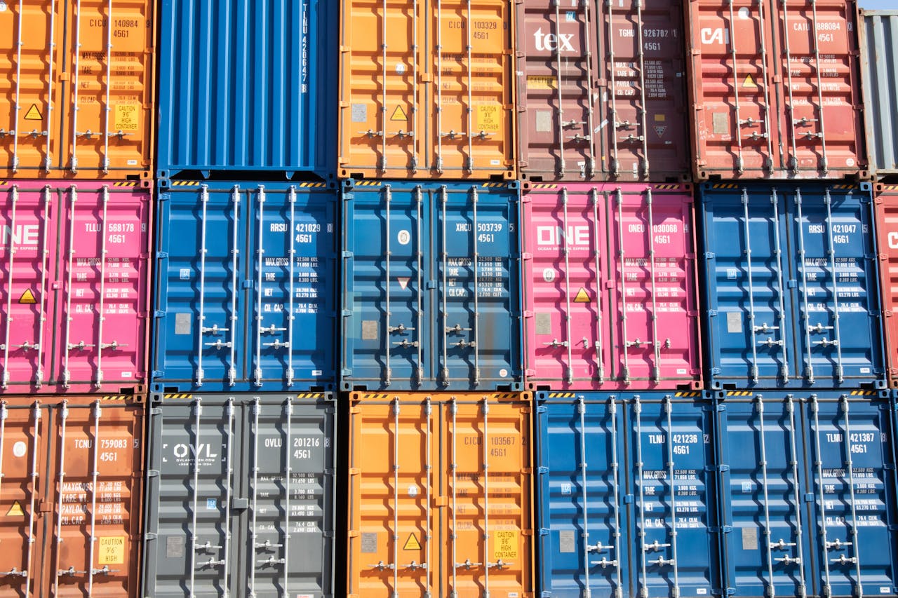 Multicolored shipping containers stacked at an international trade port, representing China wholesale export logistics