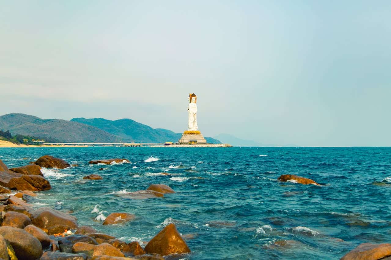 Guanyin of Nanshan statue rising 108 meters above the South China Sea at Sanya Nanshan Cultural Tourism Zone, Hainan, China.
