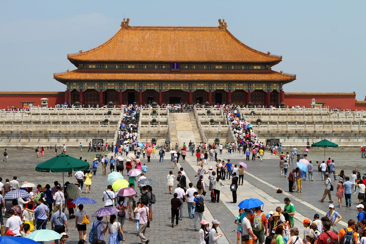 Crowds of tourists visiting the historic Forbidden City in Beijing, China, on a sunny day during a peak travel period — a popular destination for foreign travelers during May Day 2026.