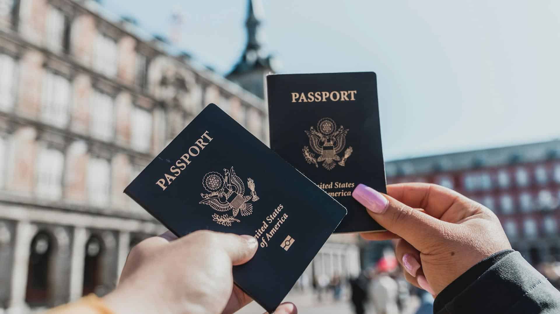 Person holding multiple passports representing the choice of visa type for travel to China