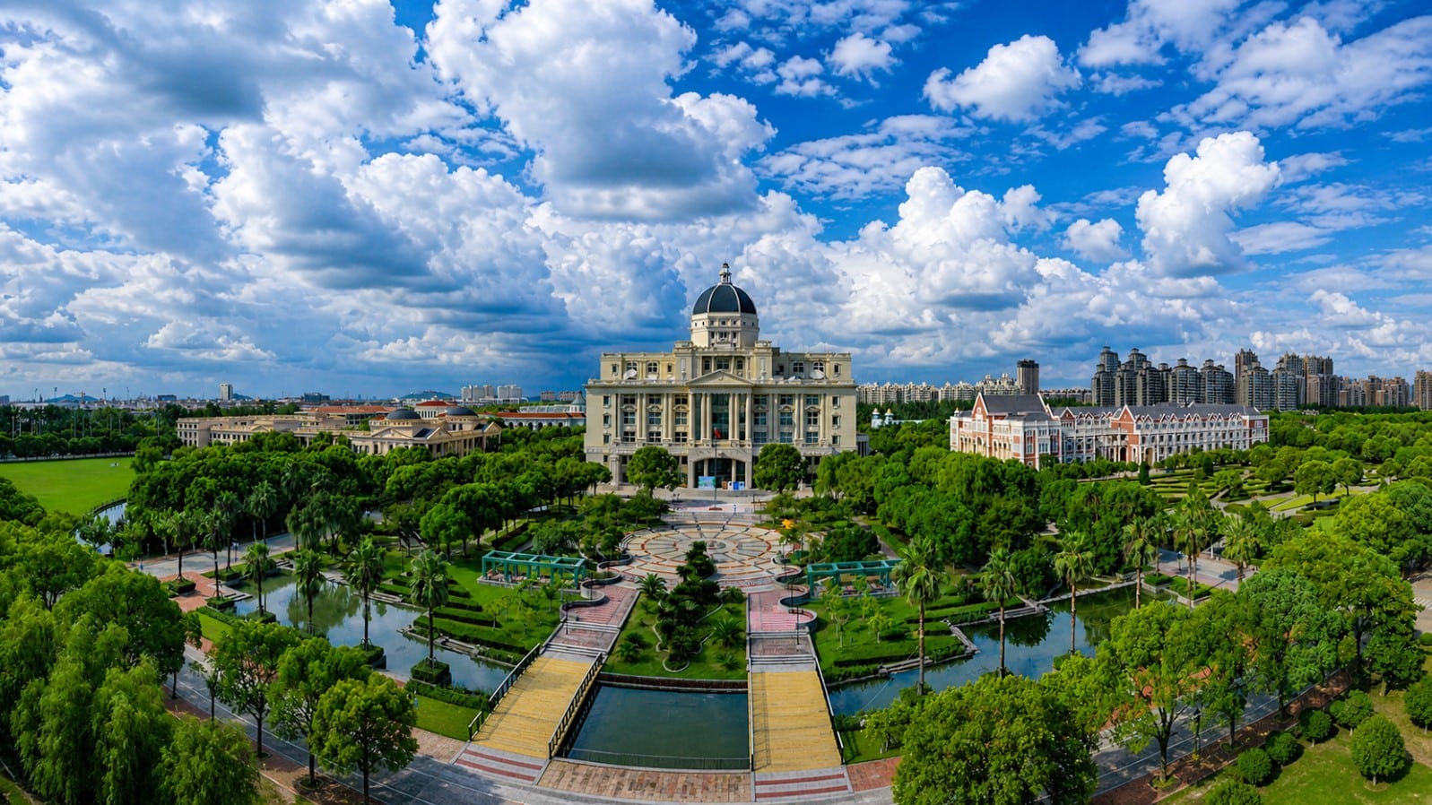 Panoramic view of Shanghai International Studies University campus with domed building, landscaped gardens, and skyline in Shanghai China