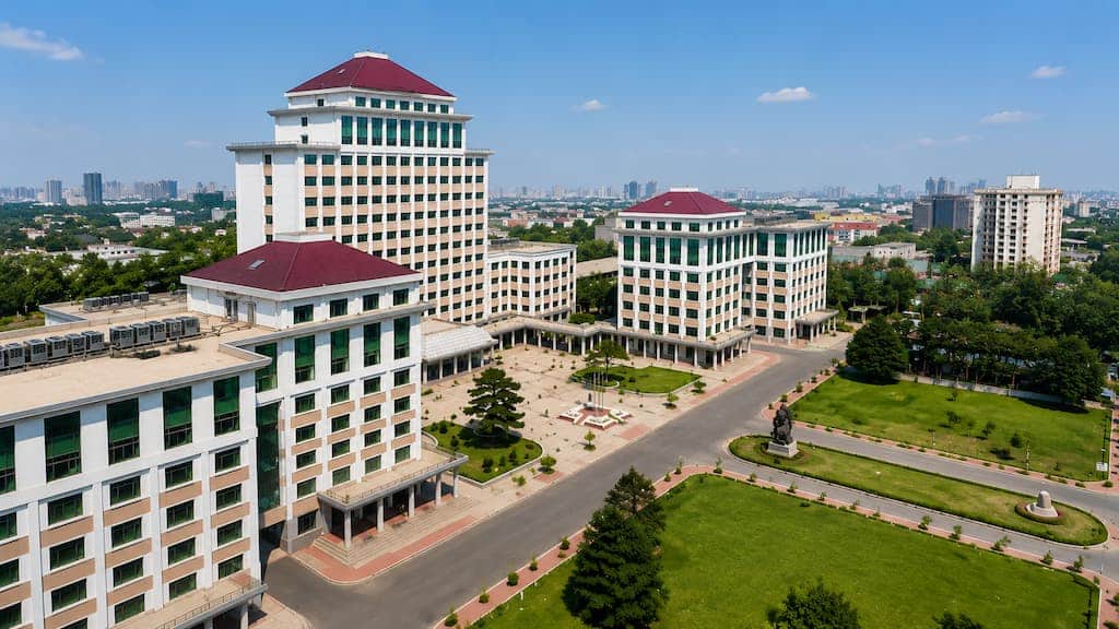 Modern aerial view of Central University of Finance and Economics campus buildings and green spaces in Beijing, China