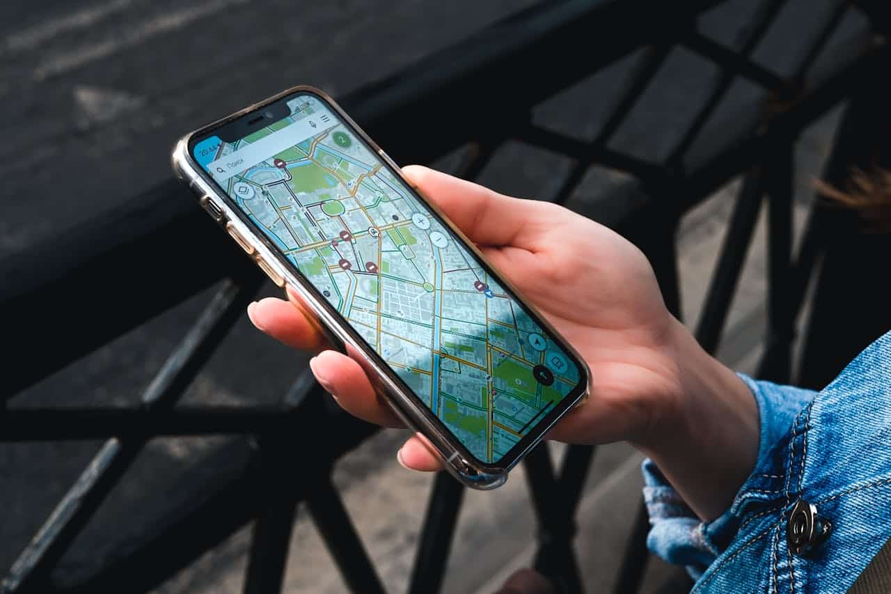 A traveler uses an AI-powered tourism app on a smartphone to navigate during a trip to China.